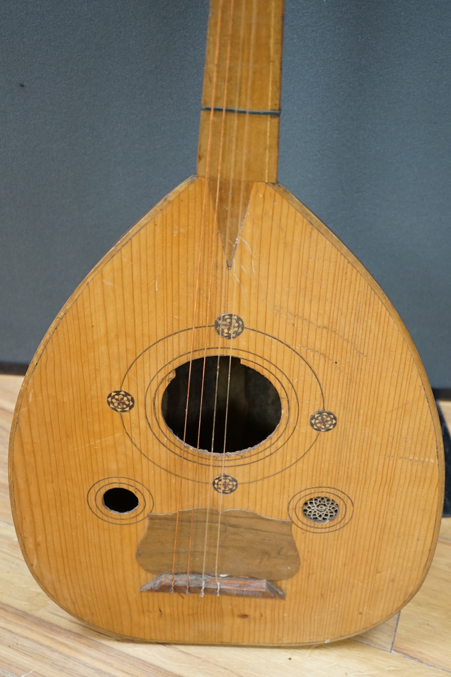 A Middle Eastern eleven string lute, overall length 82cm